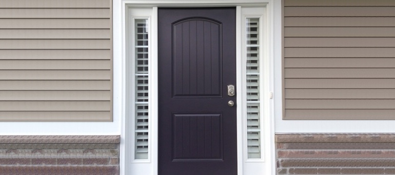 Entry Door Sidelight Shutters Next To Black Door In Philadelphia, PA